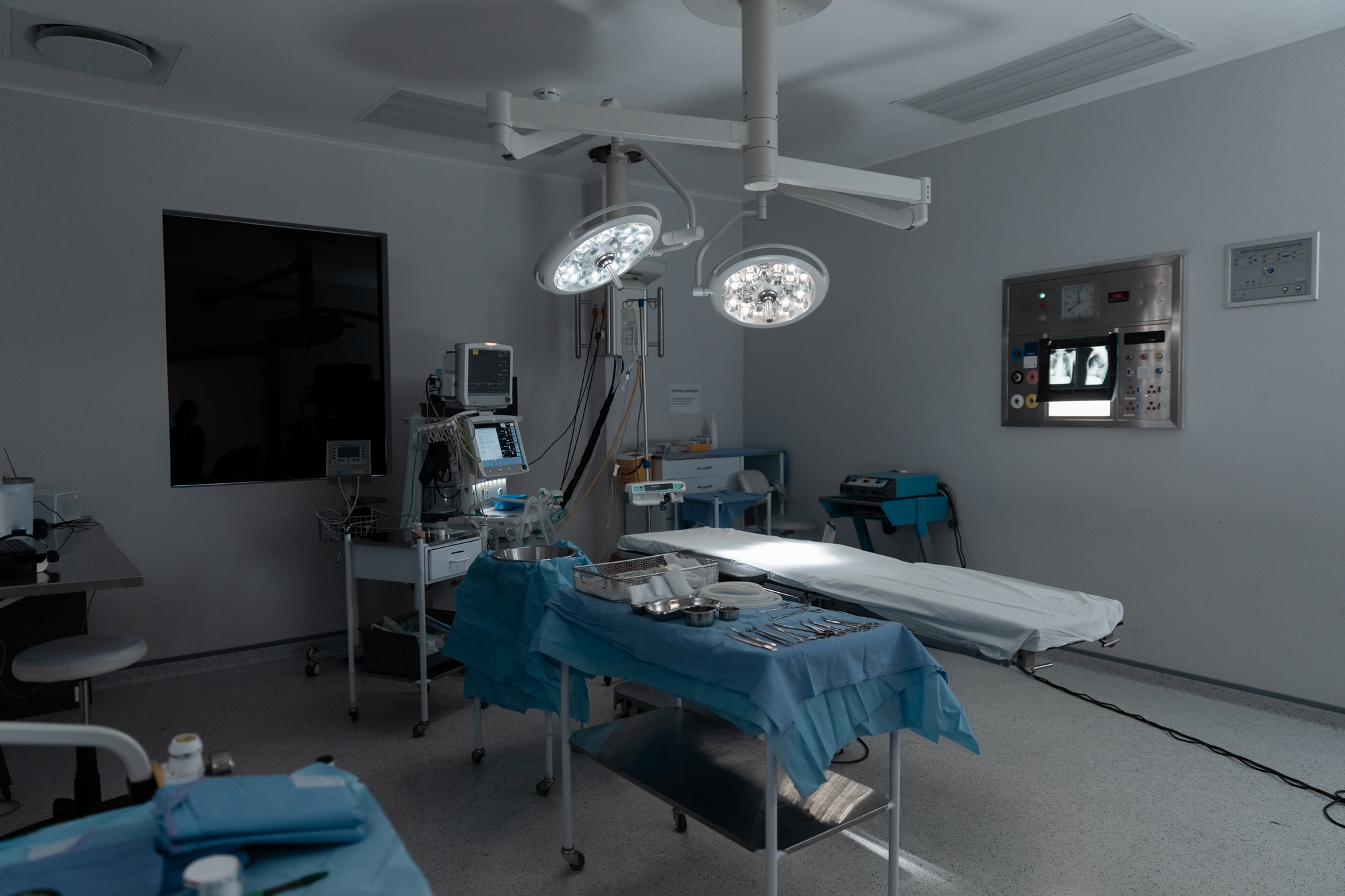 Surgical instruments, operating table, lights and equipment in modern hospital operating theatre